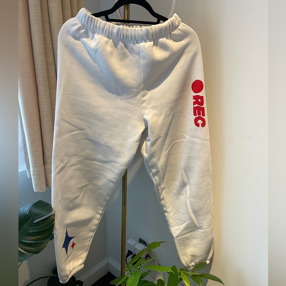 Mayfair sweatpants with red and blue embroidery on the leg.